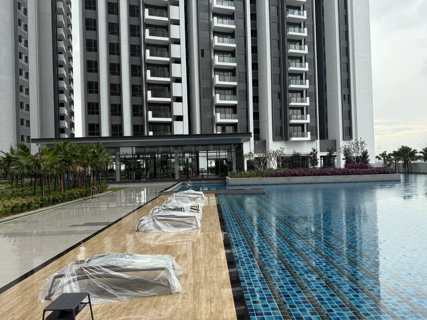 Actual photograph of the GEM Residences swimming pool and towers