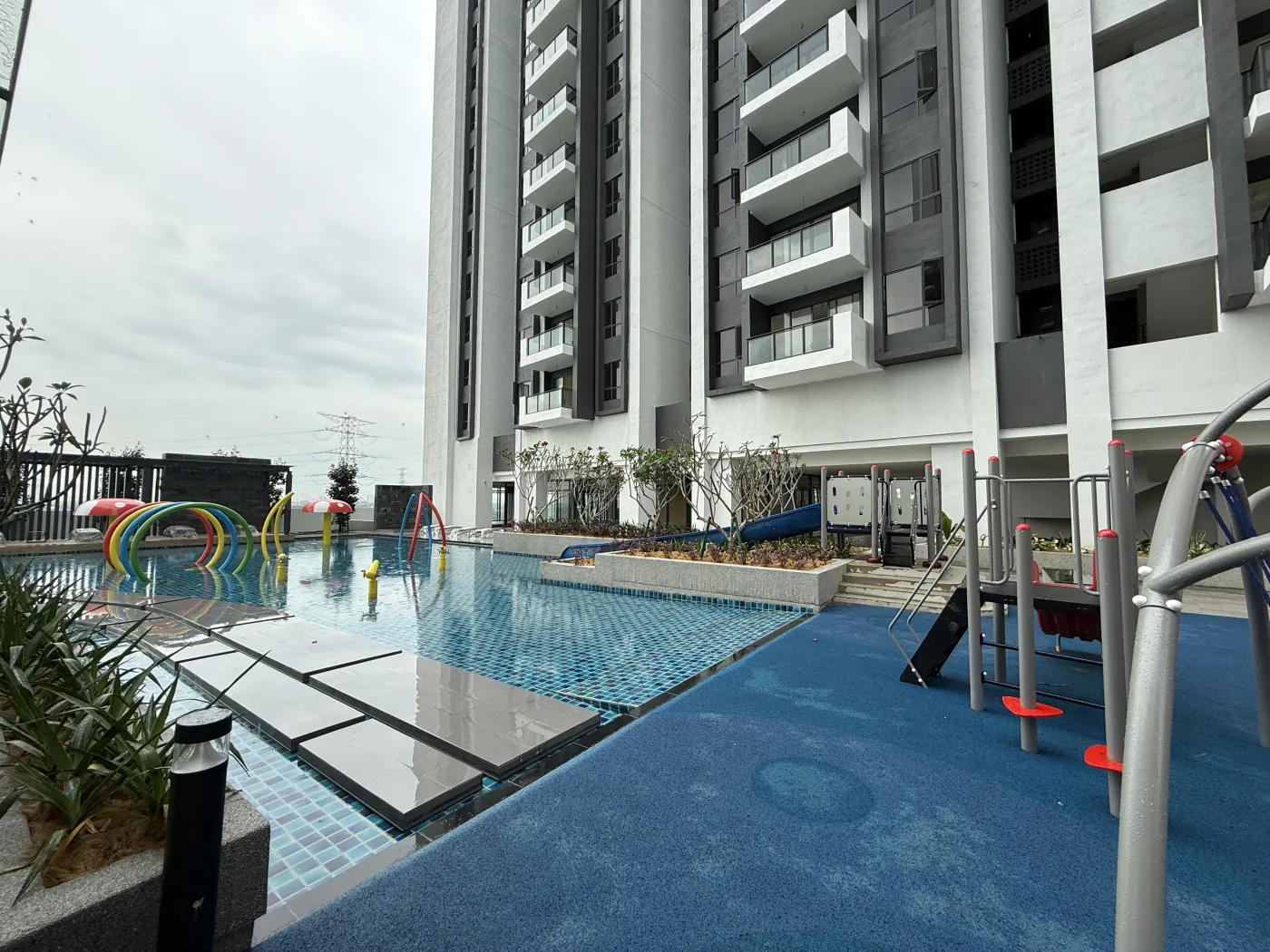 Actual photograph of the GEM Residences kids' pool and water-play area