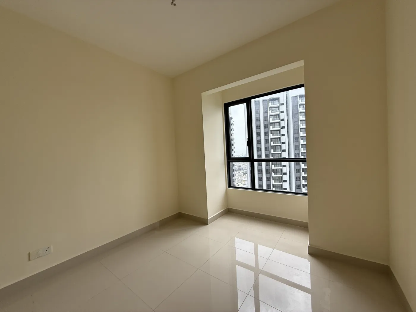 Actual photograph of an unfurnished bedroom at GEM Residences